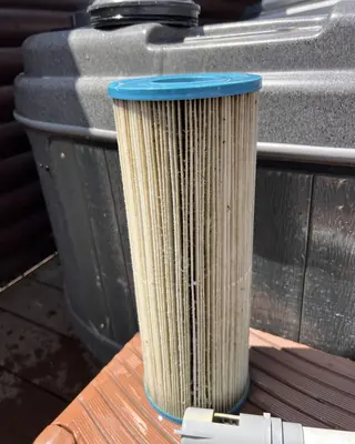 Used hot tub filter cartridge taken out of the tub