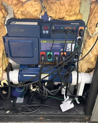 Gecko in.xm hot tub control pack inside an insulated cabinet